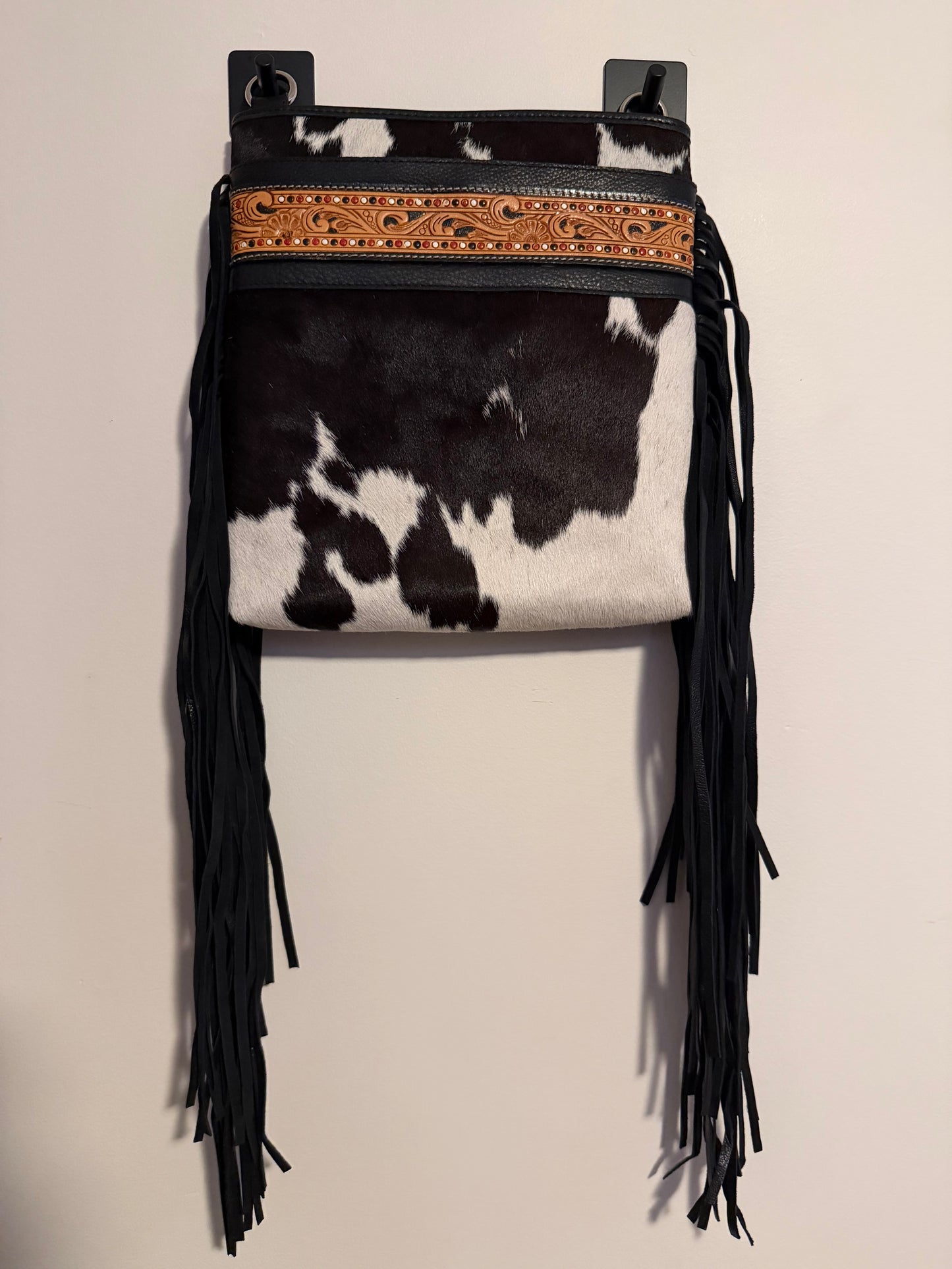 Tooled cowhide tassel crossbody