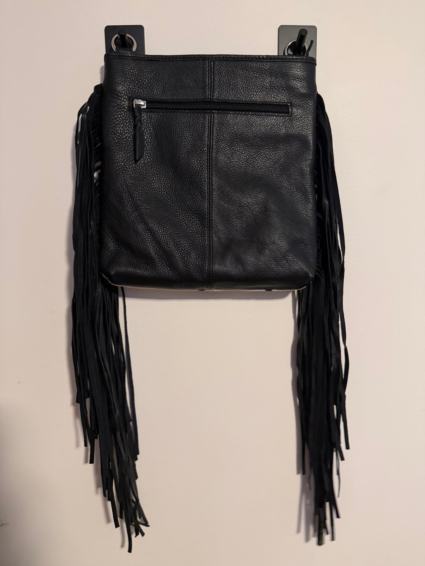 Tooled cowhide tassel crossbody