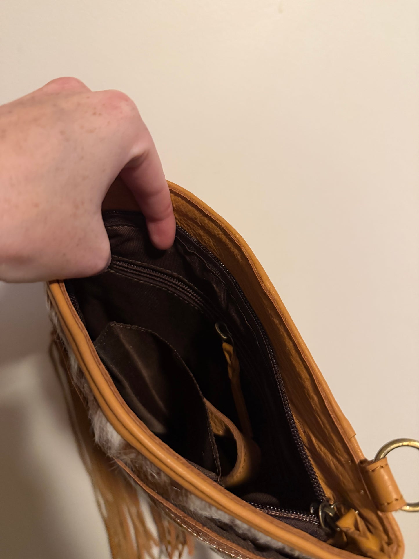 Tooled cowhide tassel crossbody