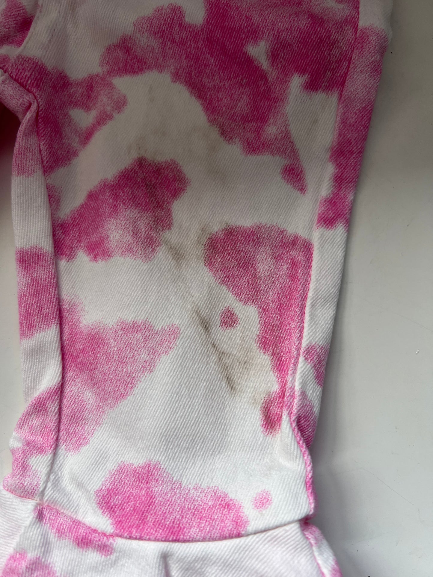 SECONDS - Kids pink cow print flare jeans SIZE 3-6 MONTHS