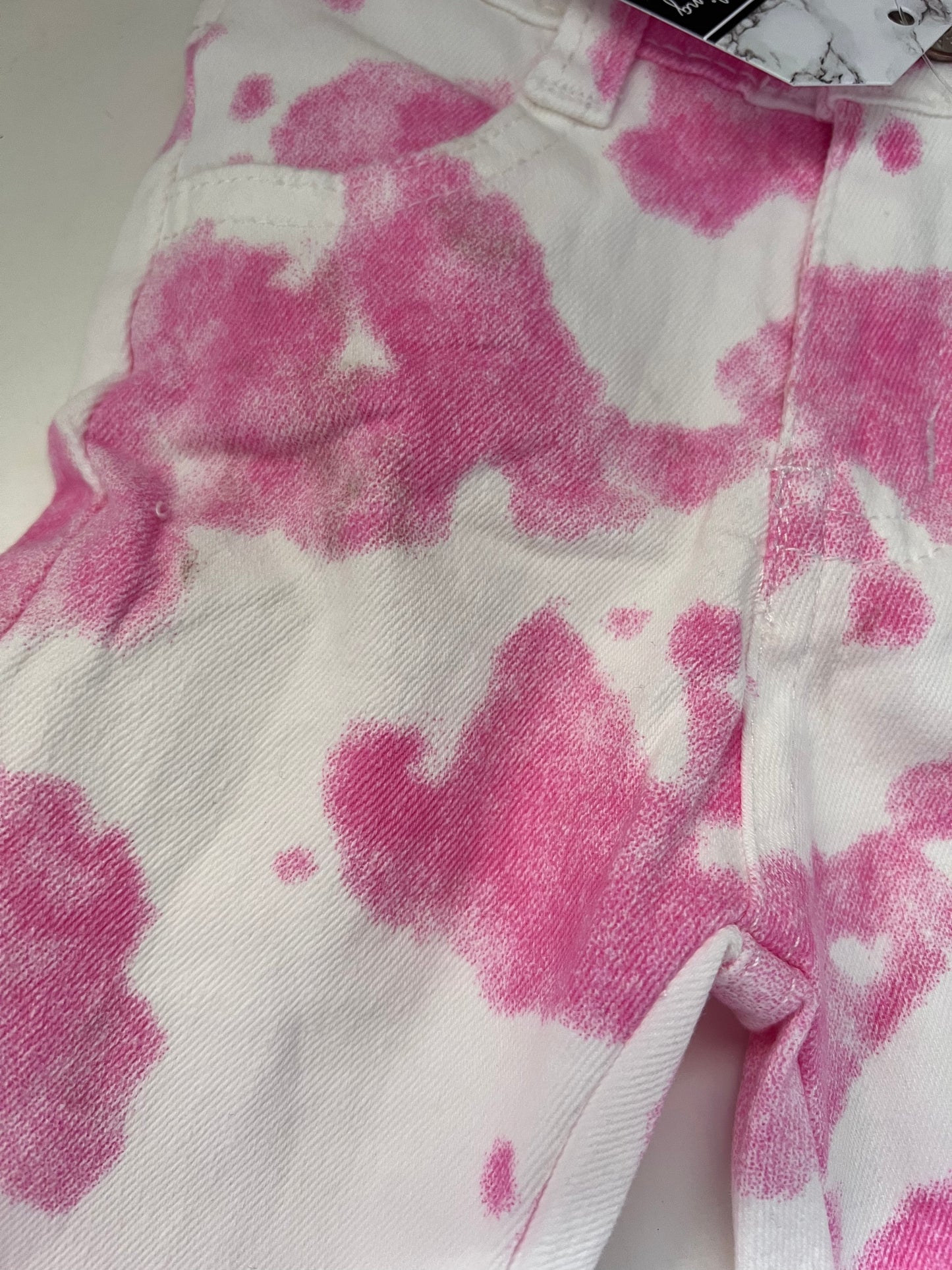SECONDS - Kids pink cow print flare jeans SIZE 3-6 MONTHS